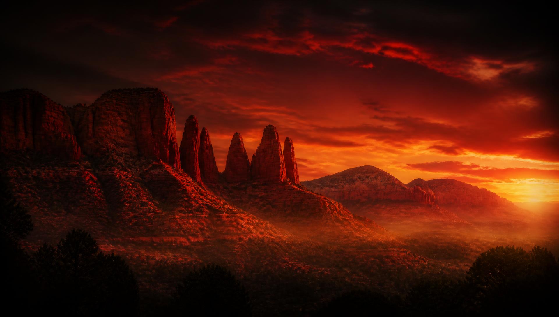 Red rock spires of Sedona, Arizona glowing at dusk